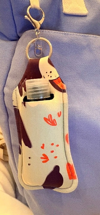 Hand sanitiser holder